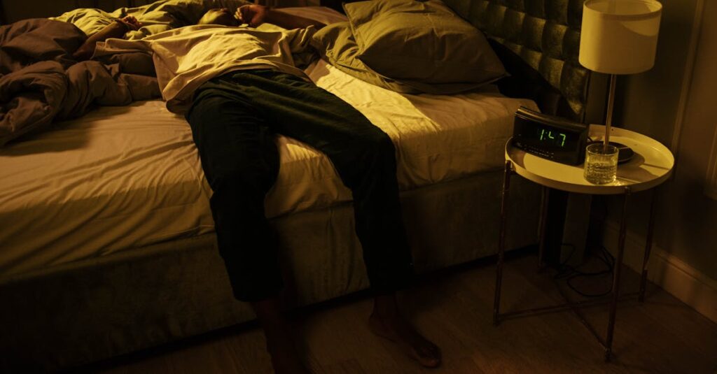 A man lies awake in bed, embodying insomnia and night-time restlessness.
