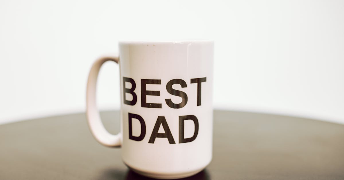 Simple white mug with 'BEST DAD' text, perfect for Father's Day gifts.