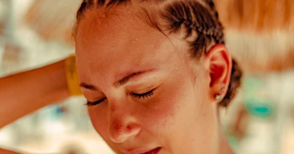 Close-up of a woman with braided hair enjoying a sunny day in Cancún, Mexico.