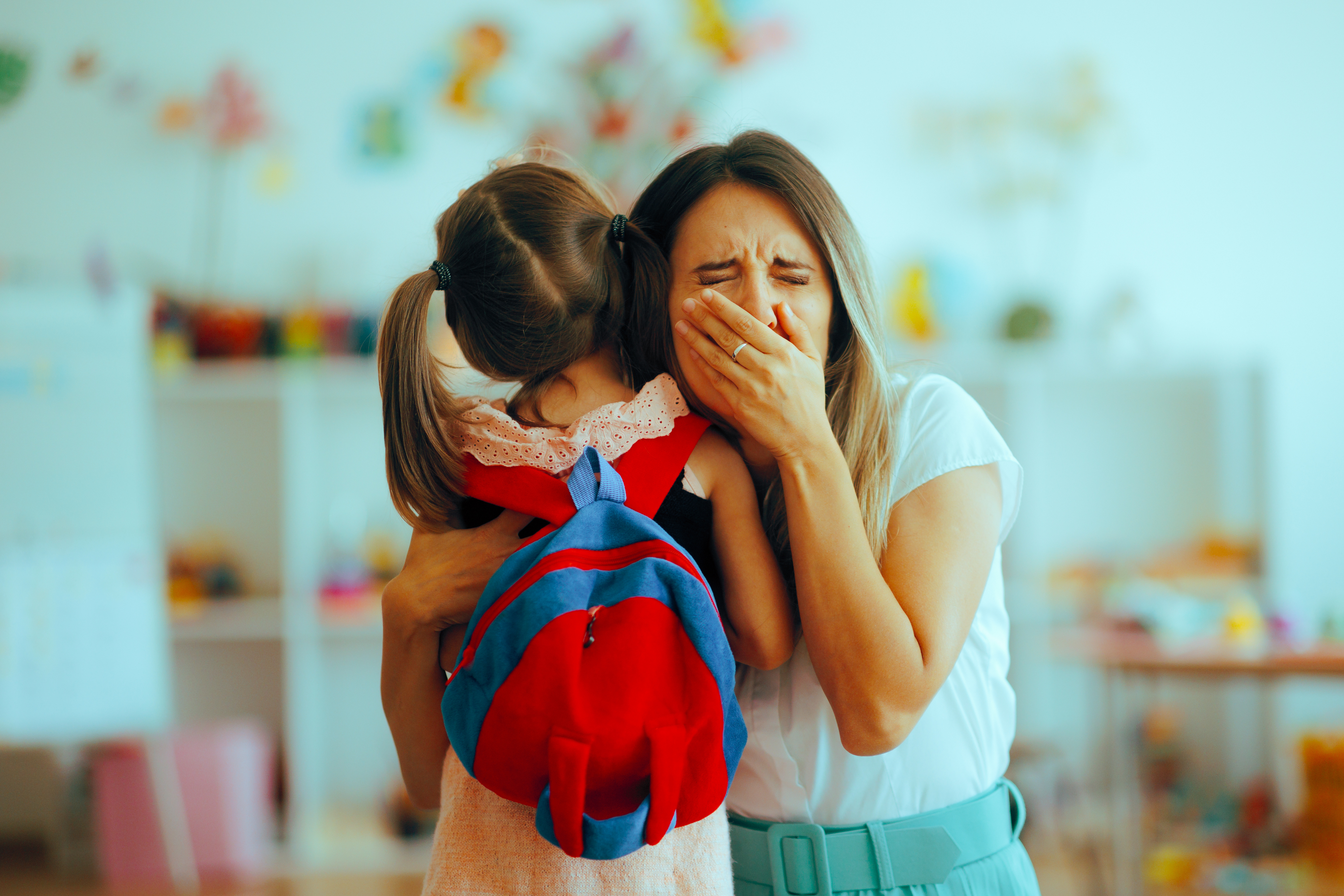 Crying Mom being Emotional on the First Day of School. Mom unable cope with the separation anxiety from going back to school. Back-to-school day.