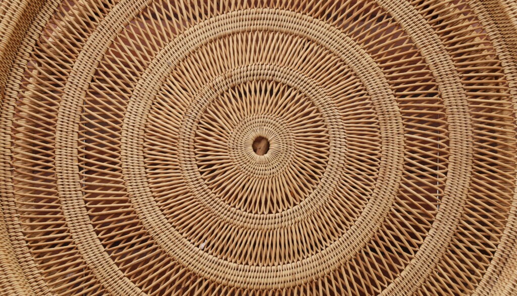 Rattan weave circles. Beautiful brown rattan furniture pattern background. Example of boho decor material
